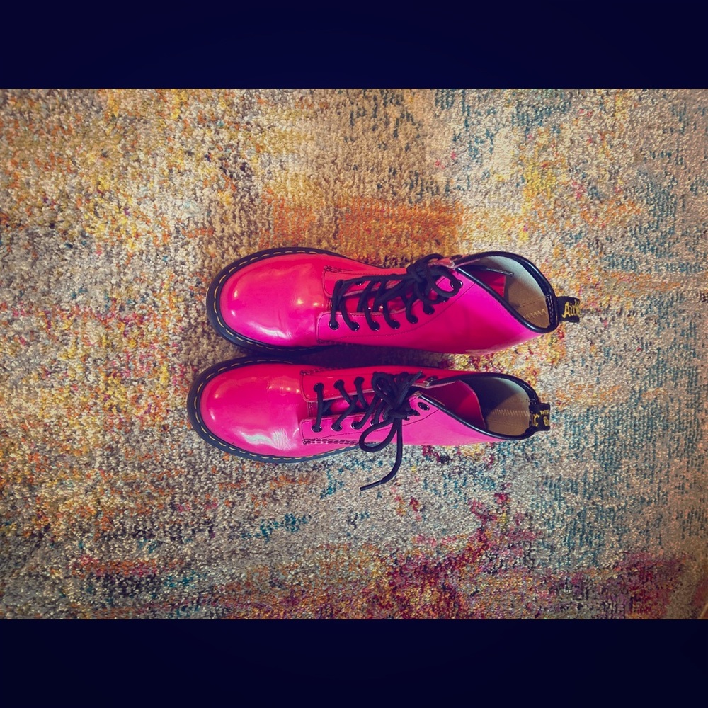 Hot Pink lace up Doc Martens with black soles.